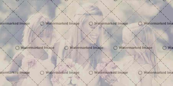 Bride With Bridesmaids Outdoors At Wedding